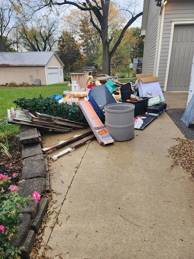 Dumpster being loaded with debris for Residential Dumpster Rental in Chubbuck